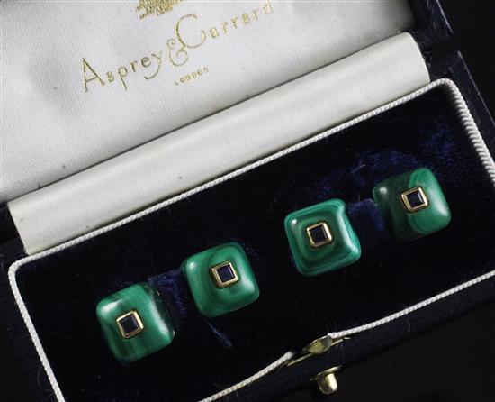 A pair of 1990s 18ct gold, malachite and sapphire set cufflinks, in Asprey & Garrard box.